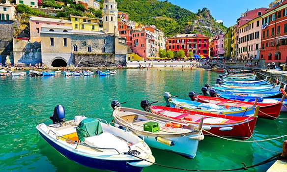 Colourful boats sitting in the water in Italy 