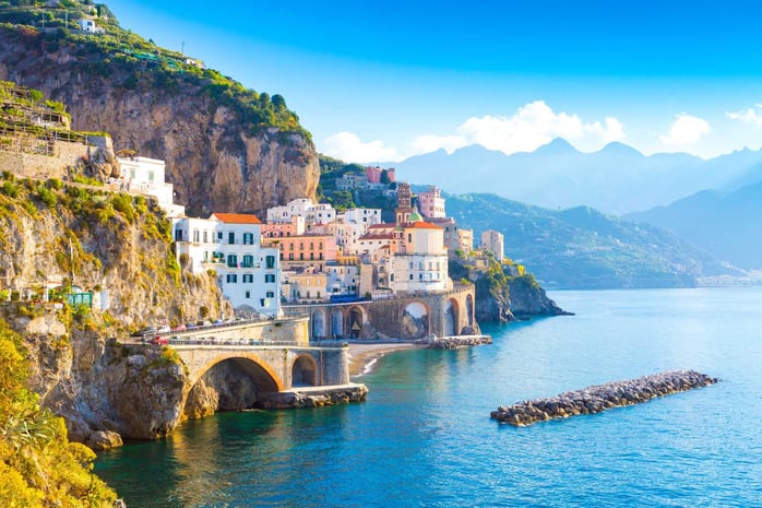 Amalfi Coast with water views and mountains in the background 