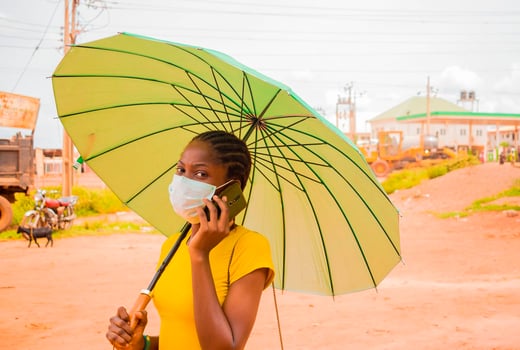 A Nigerian girls dons a face mask